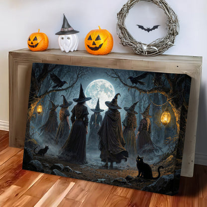 Halloween witch wall art canvas leaning on a wooden surface, showing silhouetted witches.