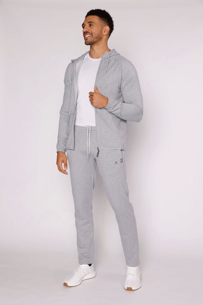 Gray athletic sweatpants with tapered fit, drawstring waist, small logo