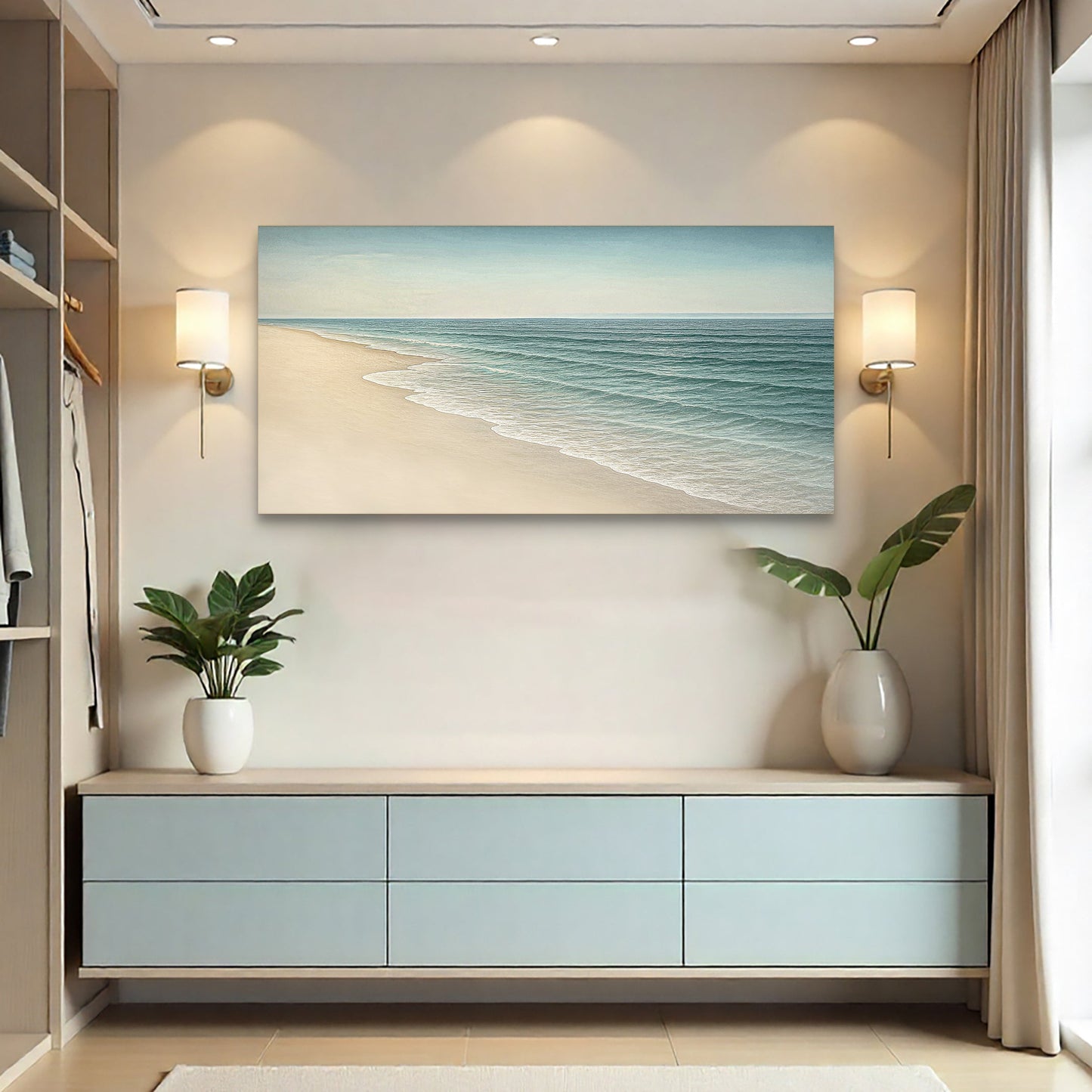 Coastal seascape canvas wall art with sandy beach and blue-green ocean waves above a cabinet.