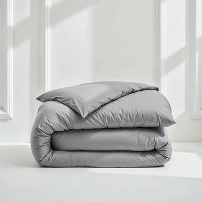 Sateen bedding bundle folded stack with gray duvet and pillow at top