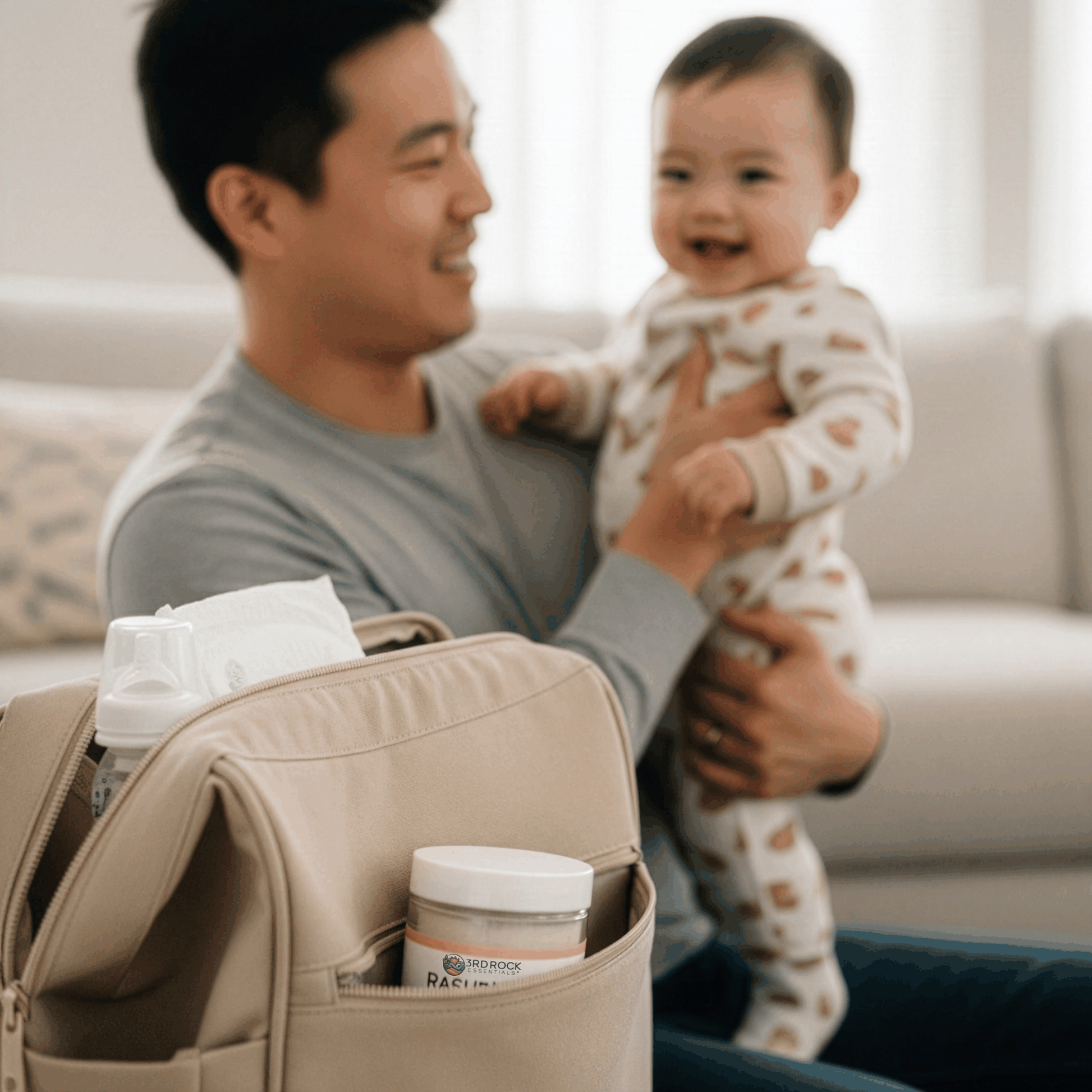 Baby with caregiver holding a diaper gel jar from an open diaper caddy