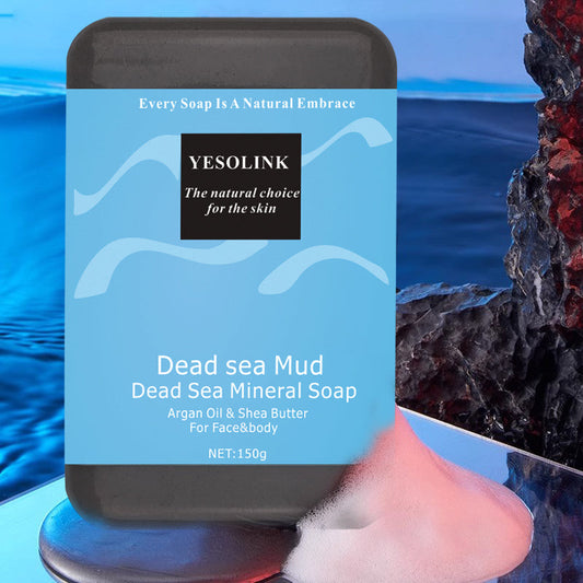 Dark gray bar soap with blue Dead sea mud mineral label and 150g weight