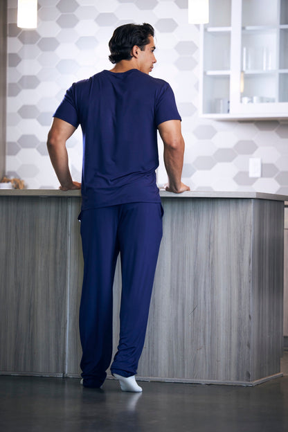 Men's lounge pajama set in navy, short-sleeve top and pants shown from back