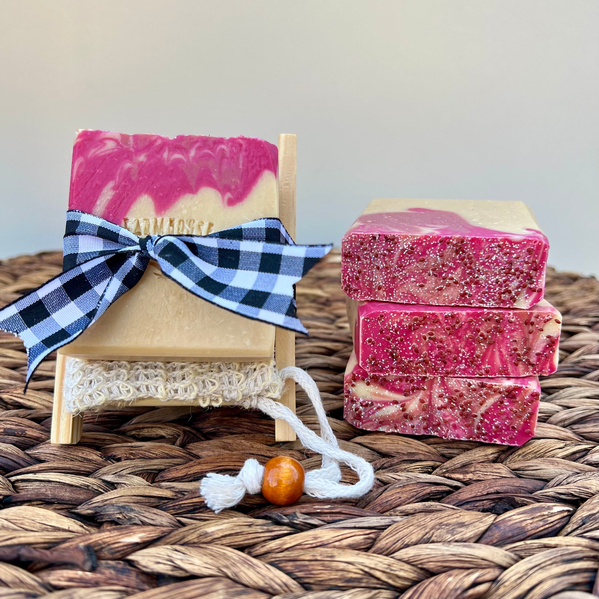 Pink and cream soap bars with a blue plaid ribbon bow and white lace trim