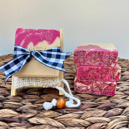 Pink and cream soap bars with a blue plaid ribbon bow and white lace trim
