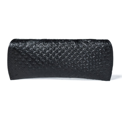 Black textured leather sunglasses cover with embossed diamond pattern, rolled cylinder shape