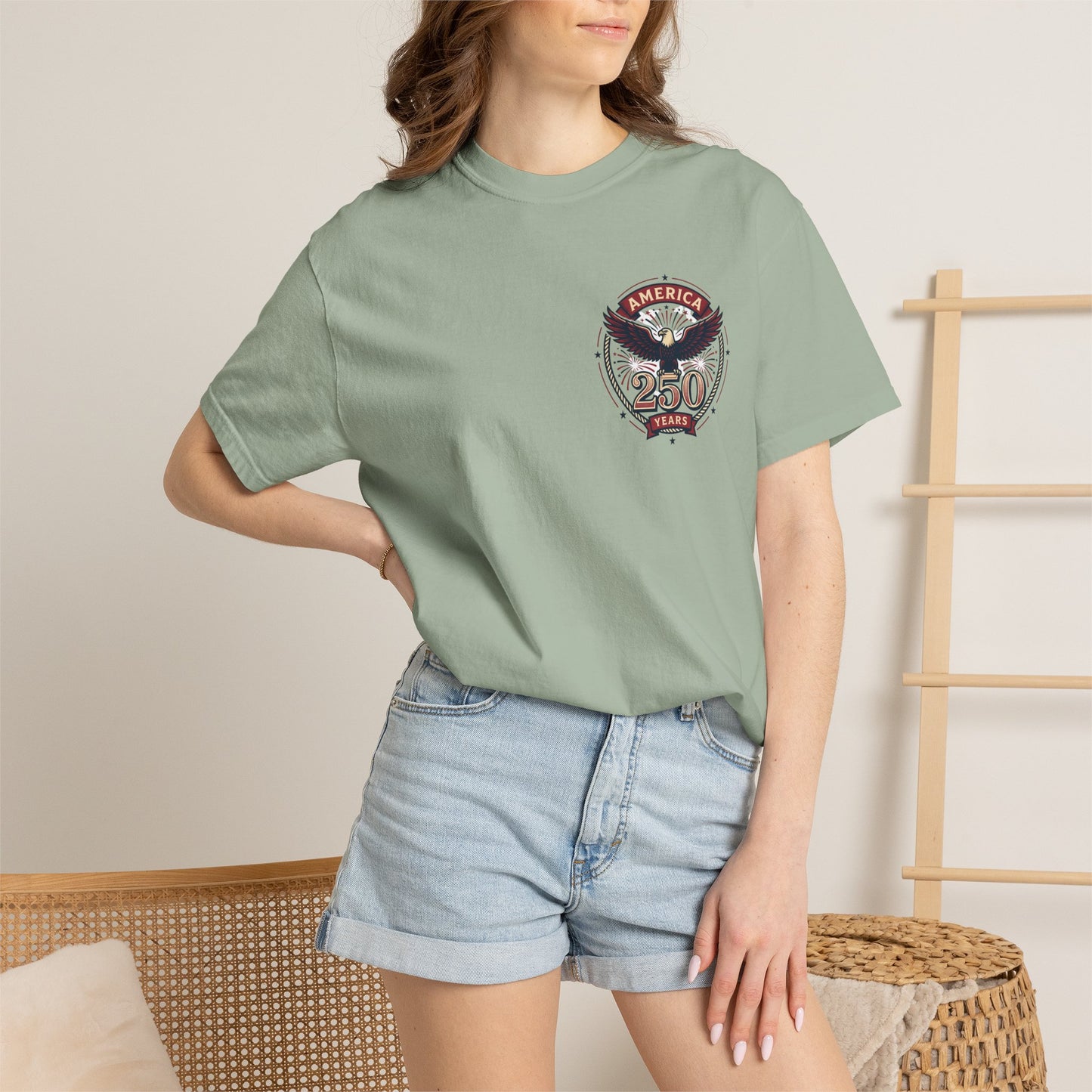 Seafoam green T-shirt with round “America 250 Years” emblem chest print