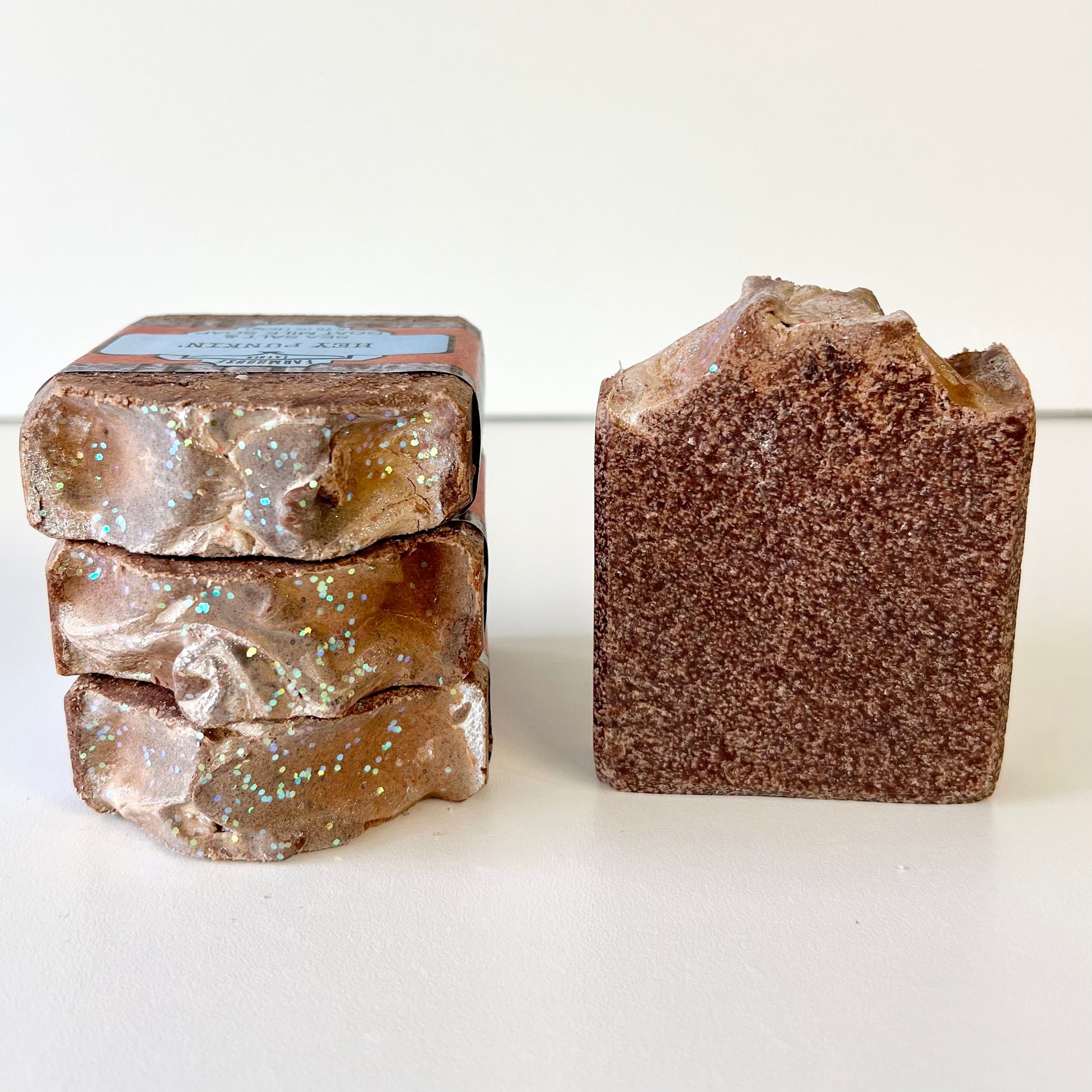 Sea salt soap bars, stacked cube and single brown speckled bar on side