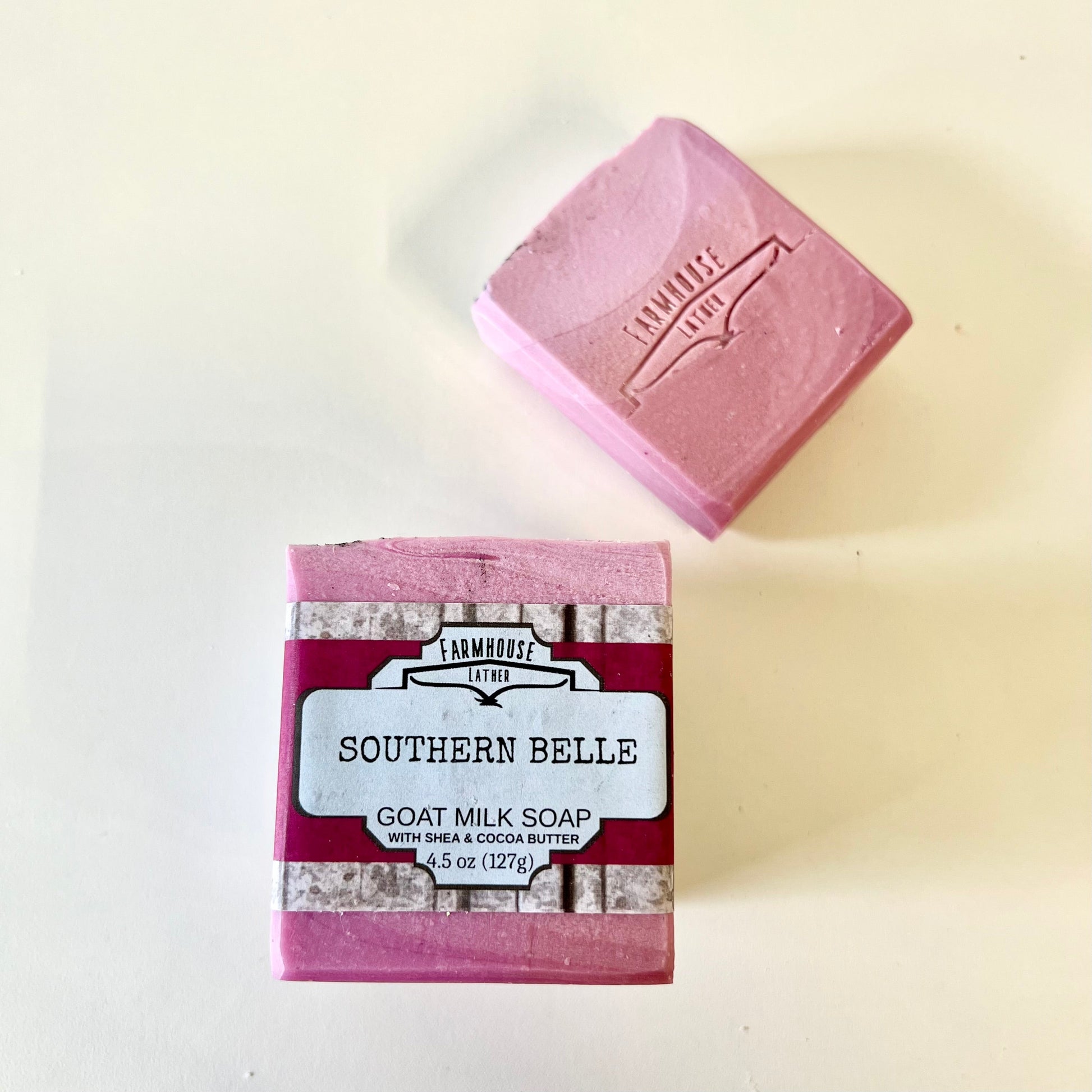 Pink goat milk soap cube with SOUTHERN BELLE label and FARMHOUSE LATTER mark