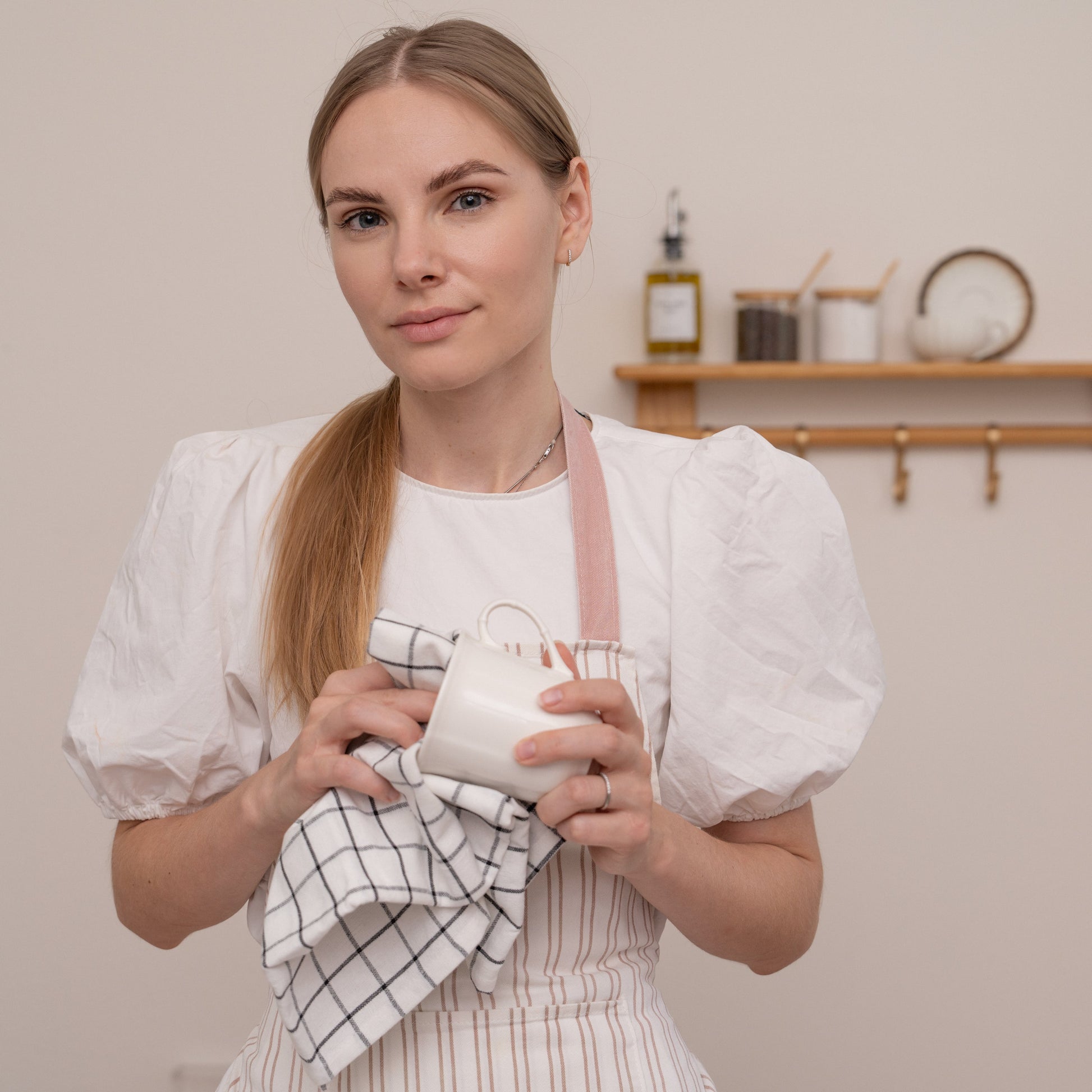 Kitchen towel set: folded check and striped towels in white with black lines
