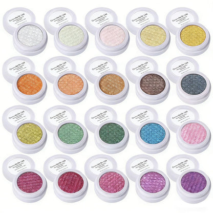 Assorted shimmer eyeshadow pans set in round white containers