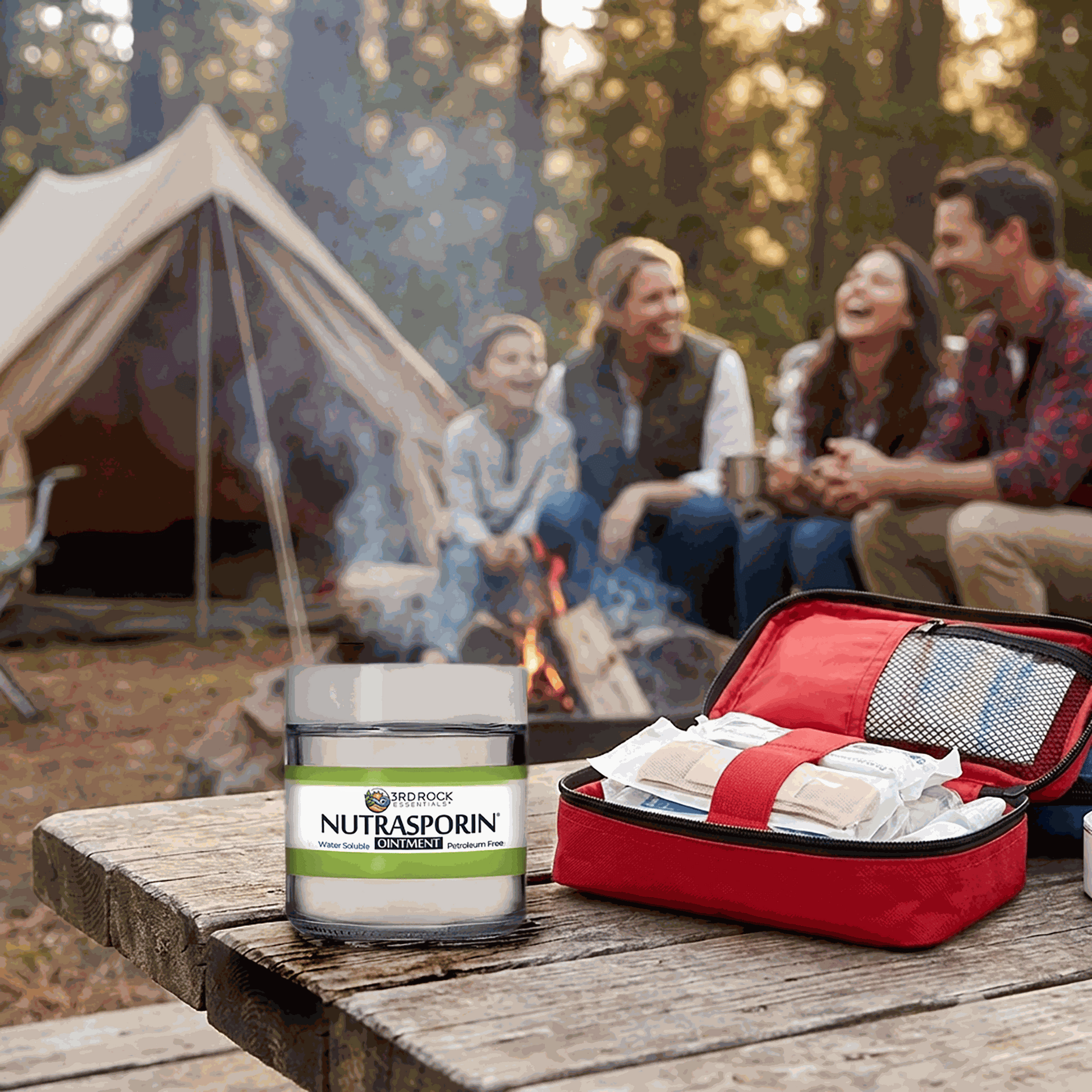 Nutrasporin ointment jar on picnic table beside open red cooler and supplies