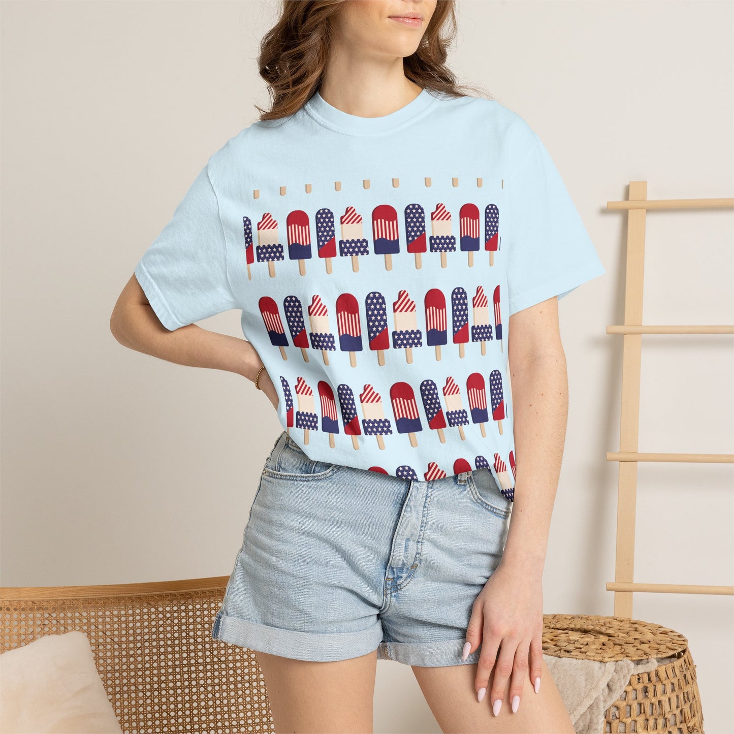 Light blue crew-neck T-shirt with American flag popsicles pattern across the front.