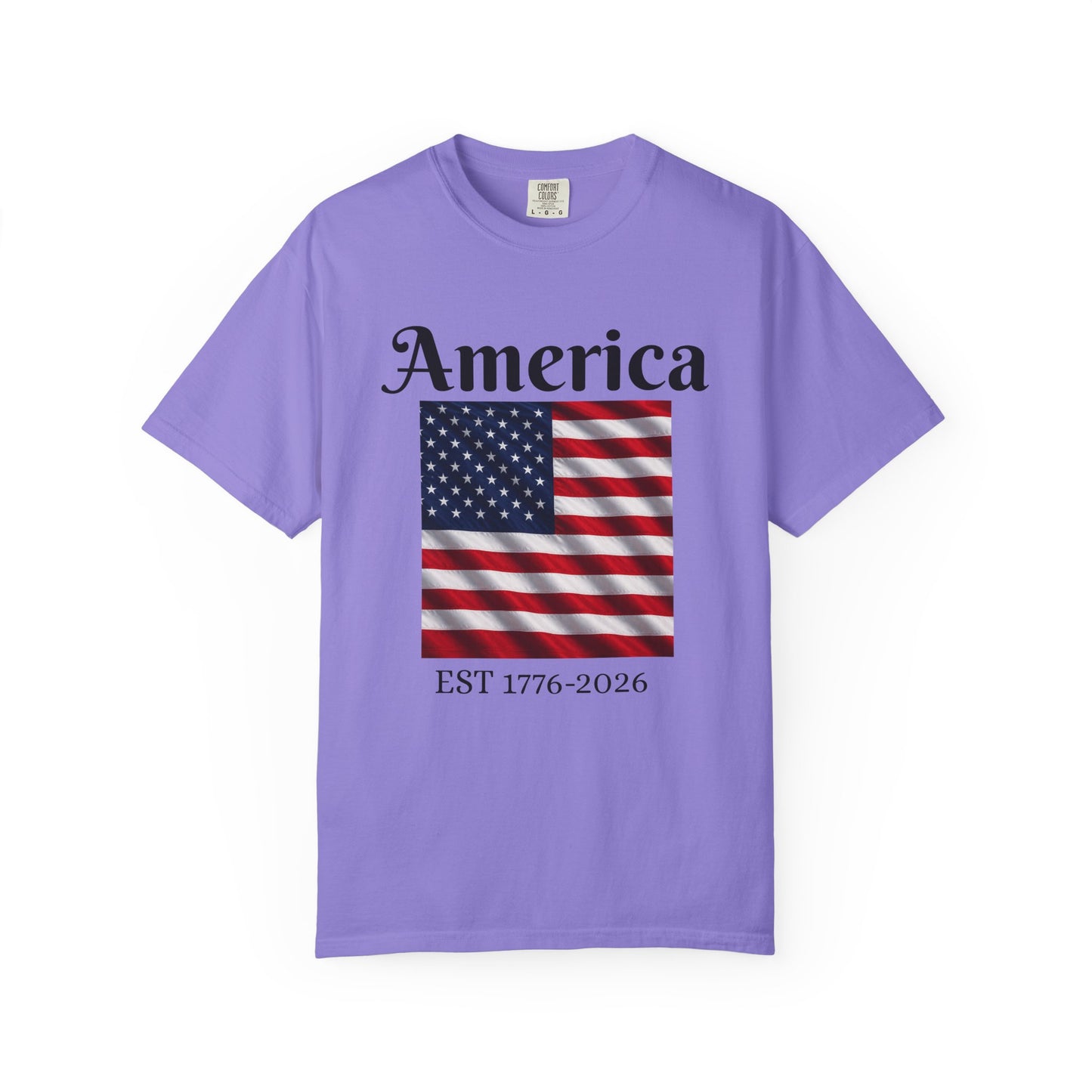 Lavender crewneck T-shirt with "America" text, American flag, and EST 1776-2026