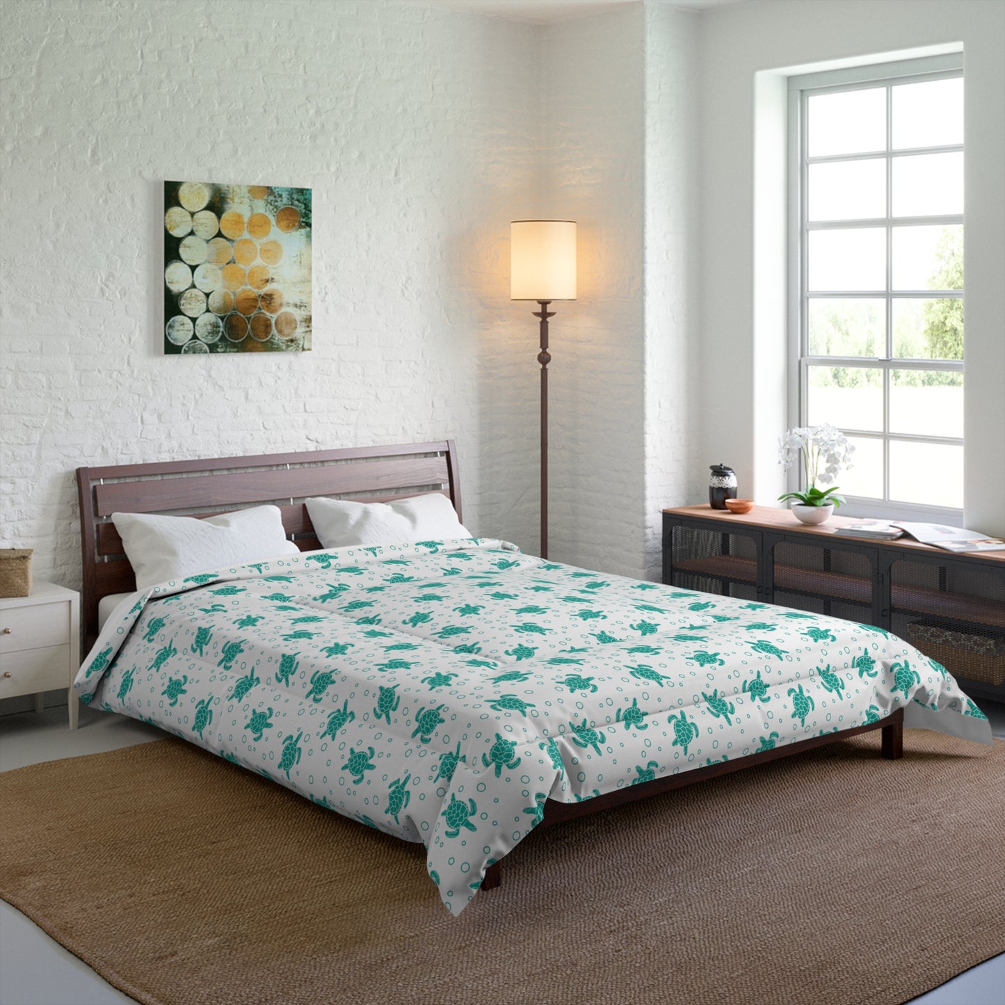 Comforter with teal floral all-over print on white, spread across bed