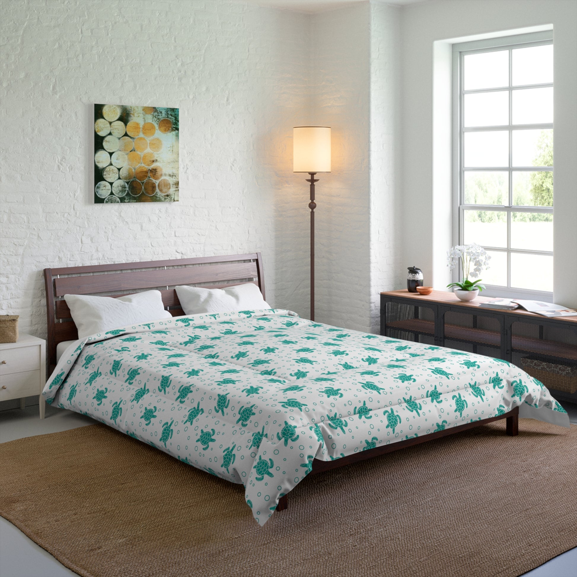 Comforter with teal floral all-over print on white, spread across bed