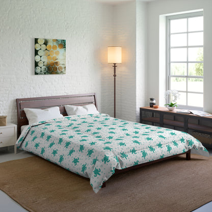 Comforter with teal floral all-over print on white, spread across bed
