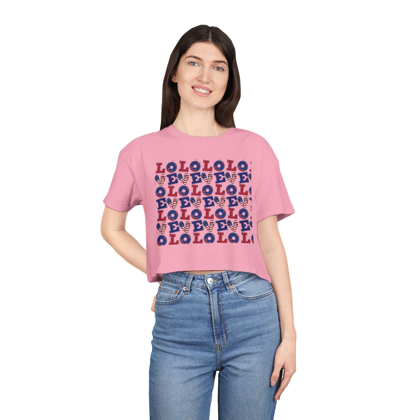 Pink crop top tee with short sleeves, crew neck, and colorful LOL pattern graphic