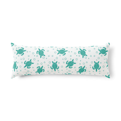 Rectangular body pillow featuring teal sea turtles and small bubble dots on light background