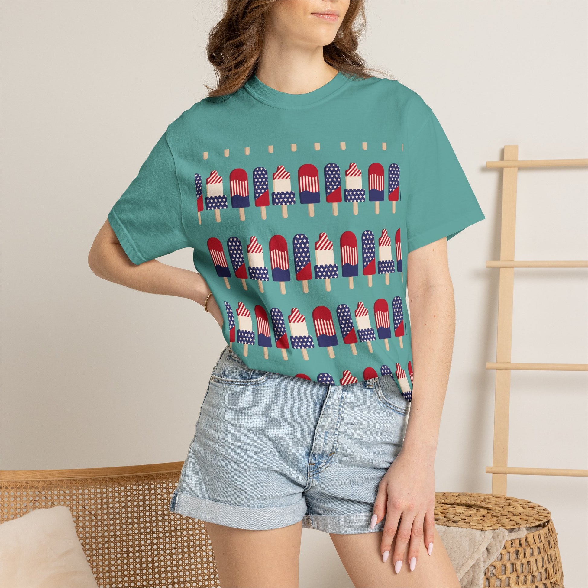 Teal crew-neck T-shirt with American flag popsicles pattern across the front.