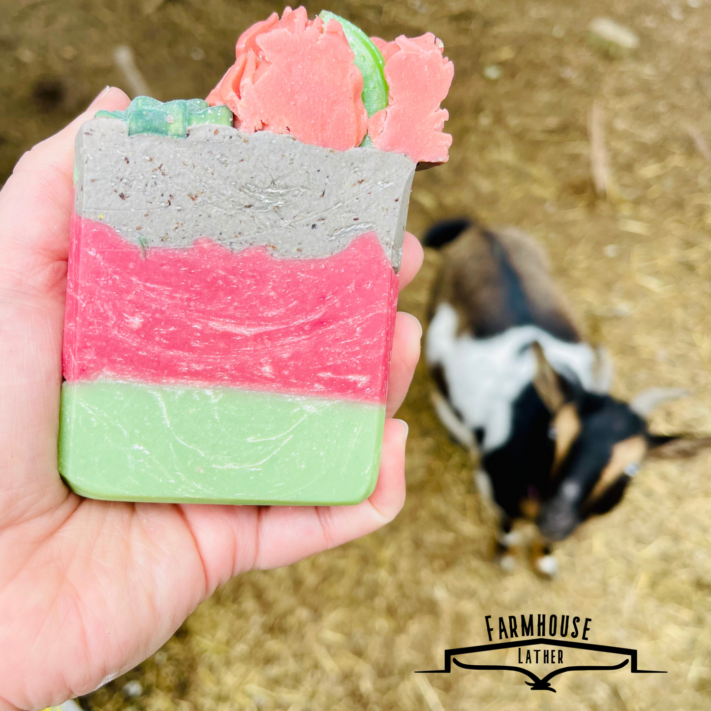 Layered artisan soap bar with lime-green base, pink strip, and speckled gray top