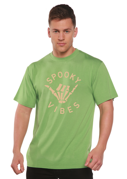 Men's graphic T-shirt in medium green with “SPOOKY VIBES” skeleton-hand design