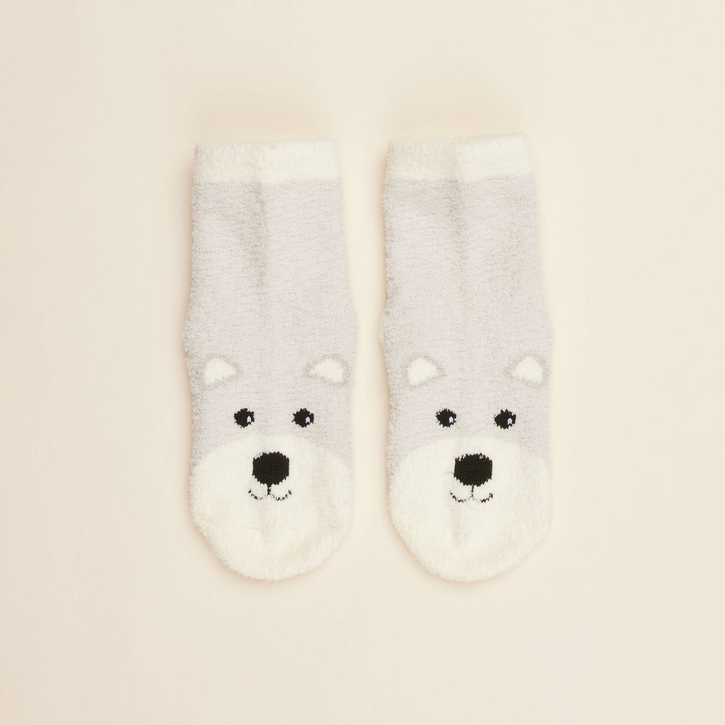 Two cream crew socks with Marshmallow Bear face and small heart accents near toe