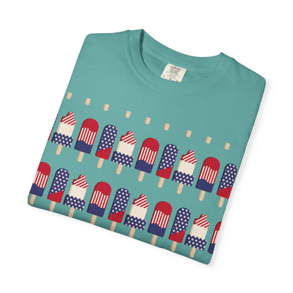 Teal T-shirt with front graphic of American flag popsicles and small beige dots.