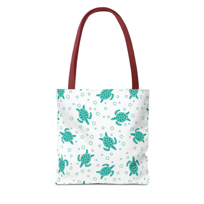 Sea turtle pattern tote bag with teal repeating turtles and red carry handles
