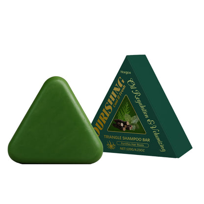 Green triangle shampoo bar with herbal label, shown from two angles