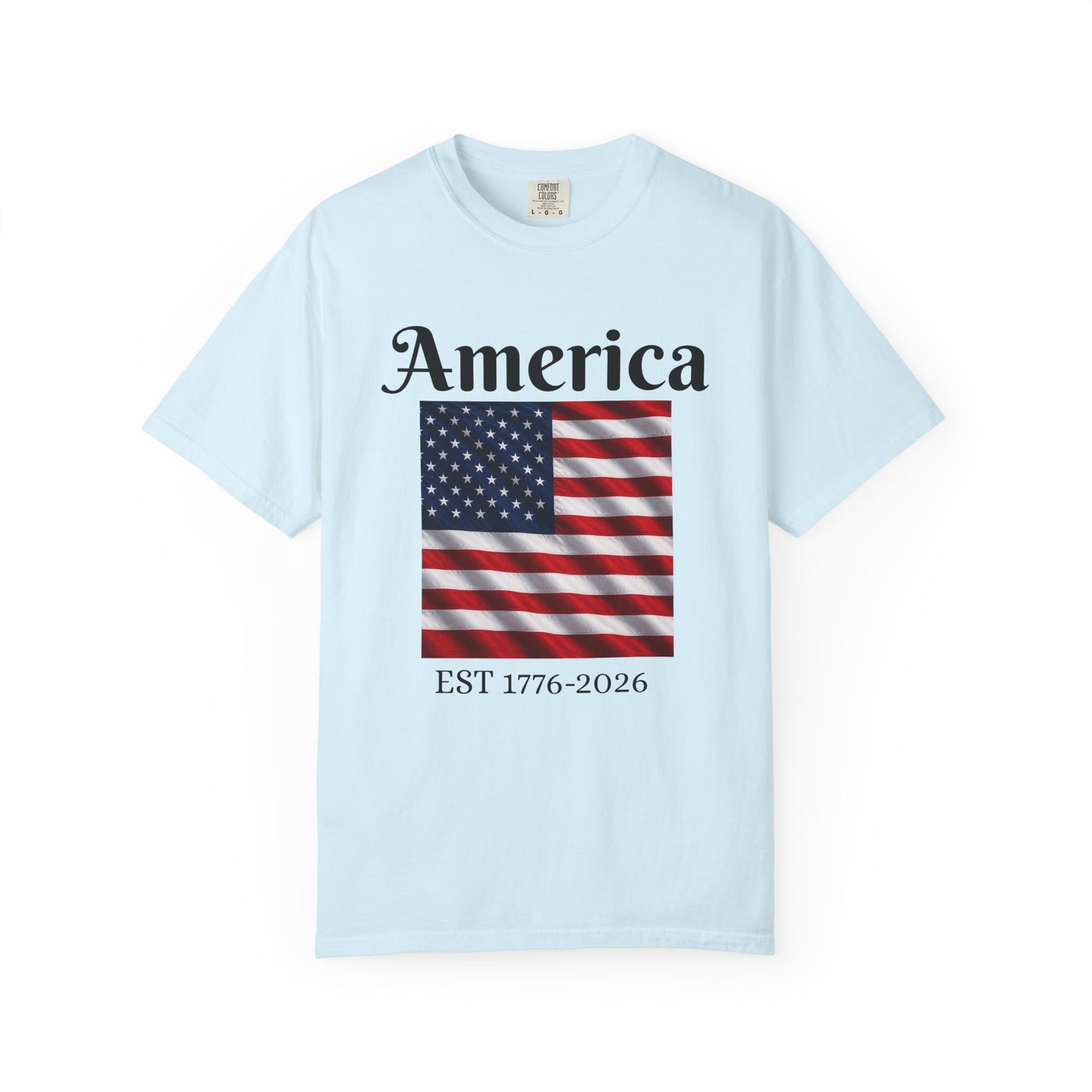 Light blue T-shirt with “America” over US flag and “EST 1776-2026” graphic on front