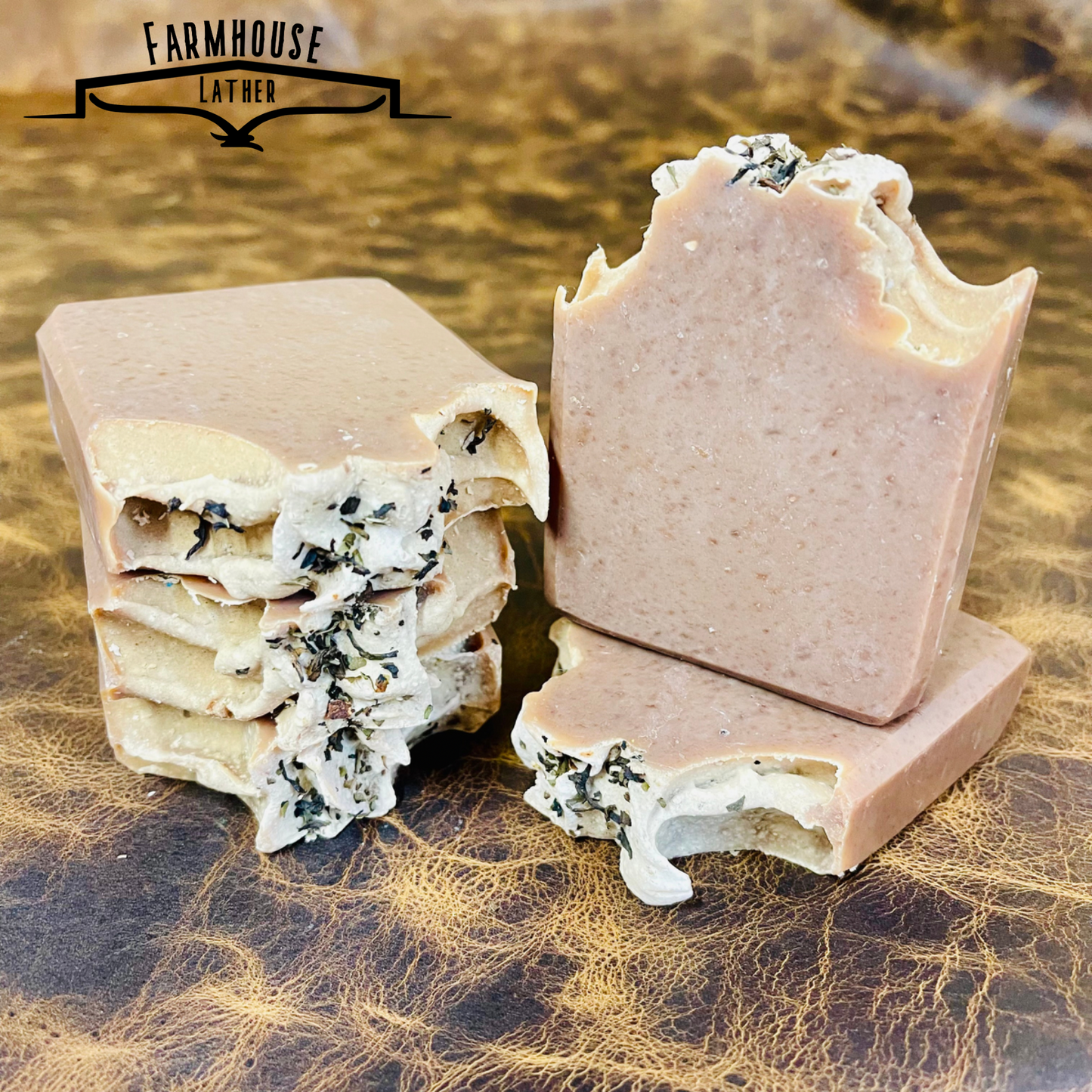 Bar soap cut pieces and whole bars with herb flecks; beige and tan exterior