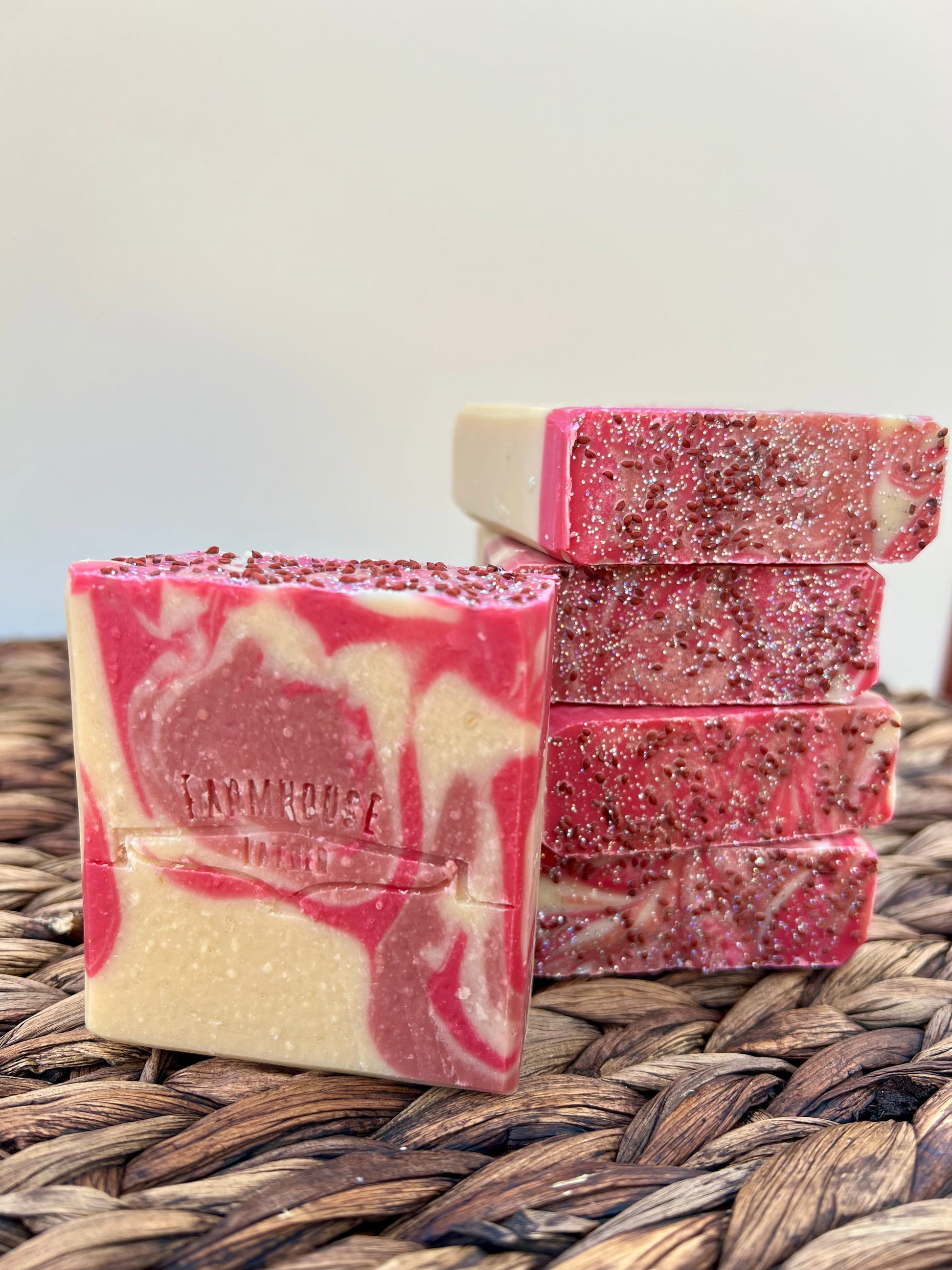 Stacked pink and cream soap bars with glittery pink top layer