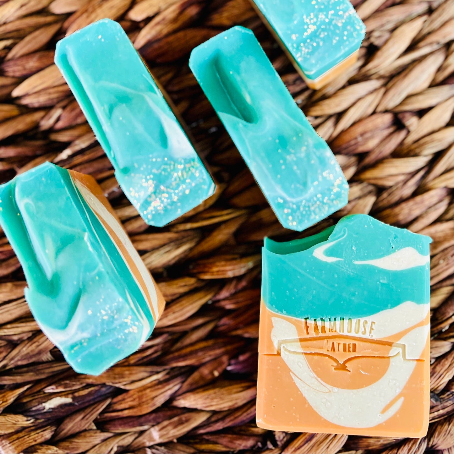 Turquoise and teal soap bars with speckled texture and stacked bars