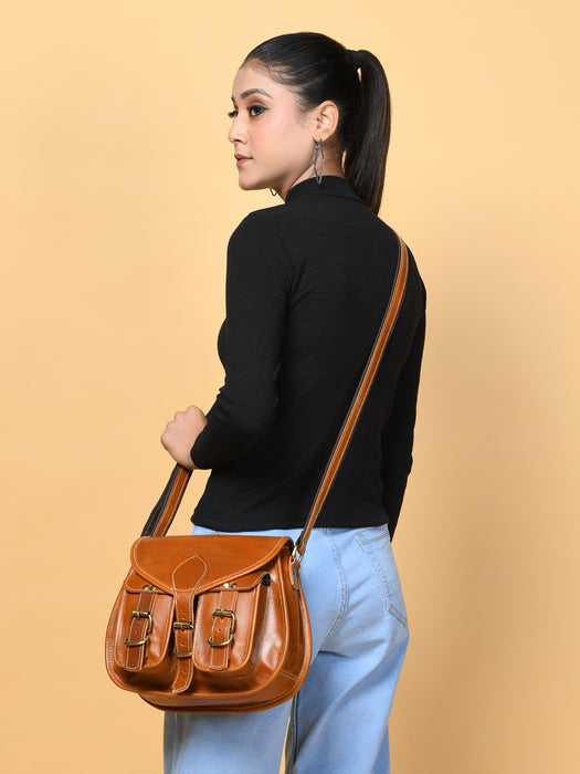 Brown leather womens crossbody sling bag with flap and two front buckle pockets