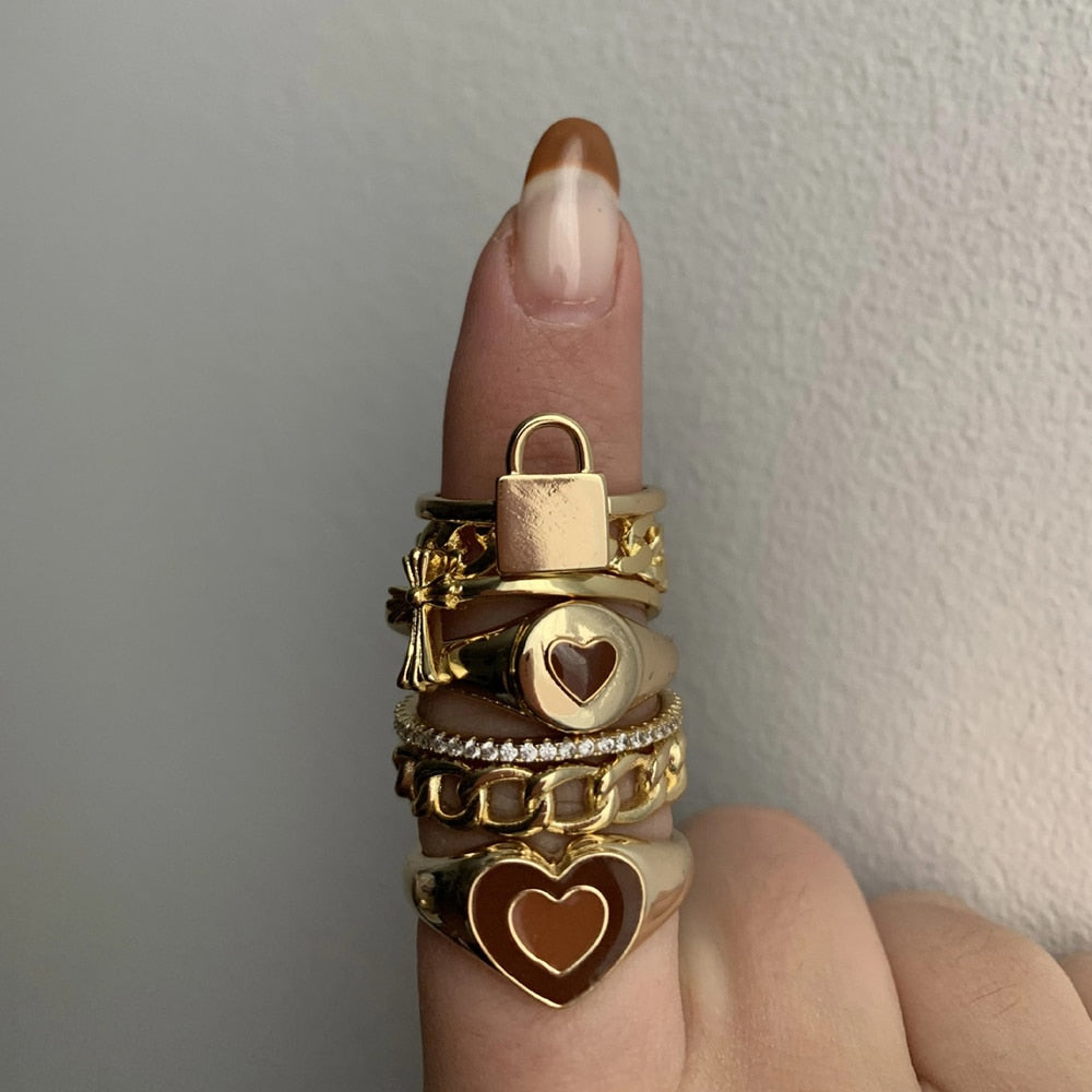 Stacked heart enamel ring with gold-tone band and dark heart charm