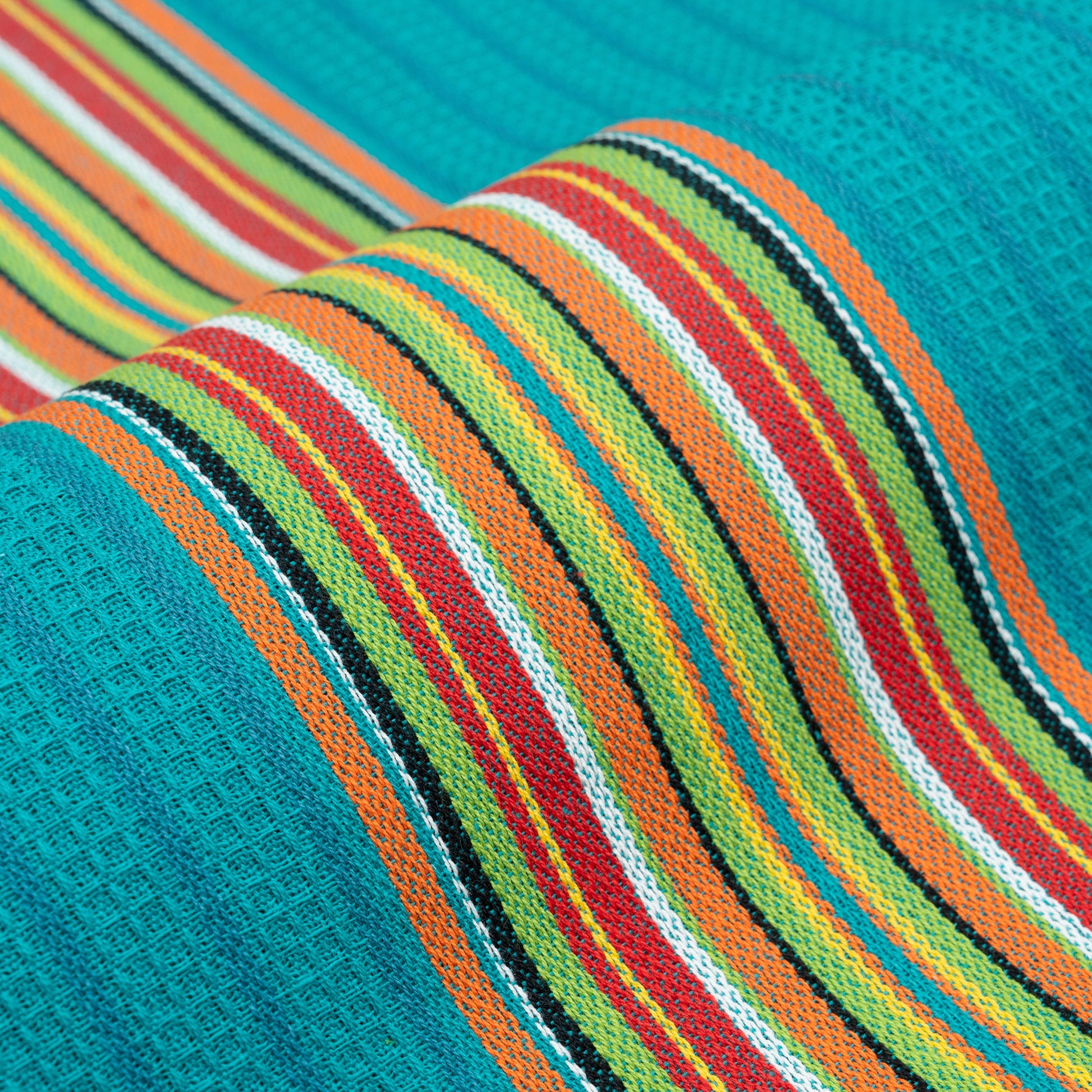 Striped kitchen towel fabric close-up in teal, green, and orange with white and red stripes