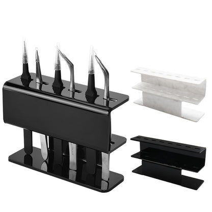 Black acrylic eyelash tweezer holder with two-tier stand and cutout slots