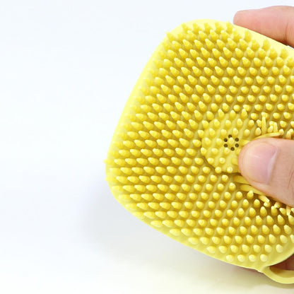 Yellow silicone-style dog bath brush pad with small raised cleaning bumps