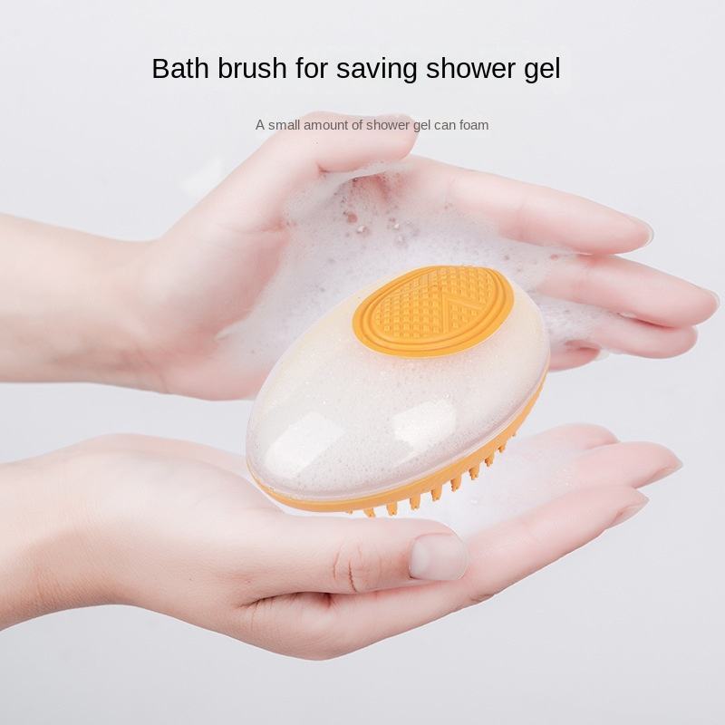2-in-1 pet bath brush with soft silicone bristles, orange, in foamy water