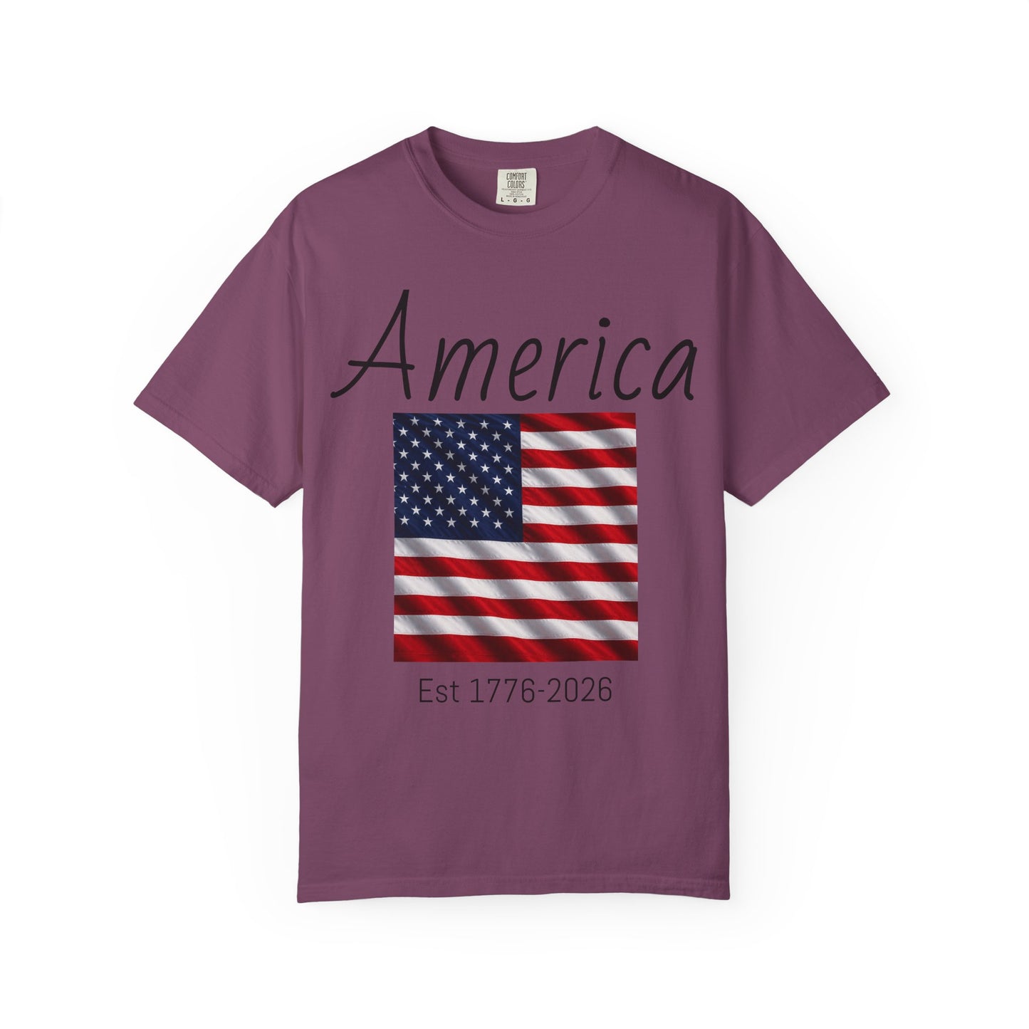 Purple unisex t-shirt with “America” script, U.S. flag, and “Est 1776-2026”