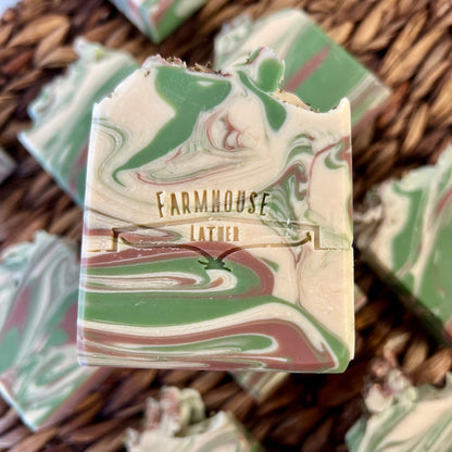 Marbled soap bar close-up with cream and green swirls