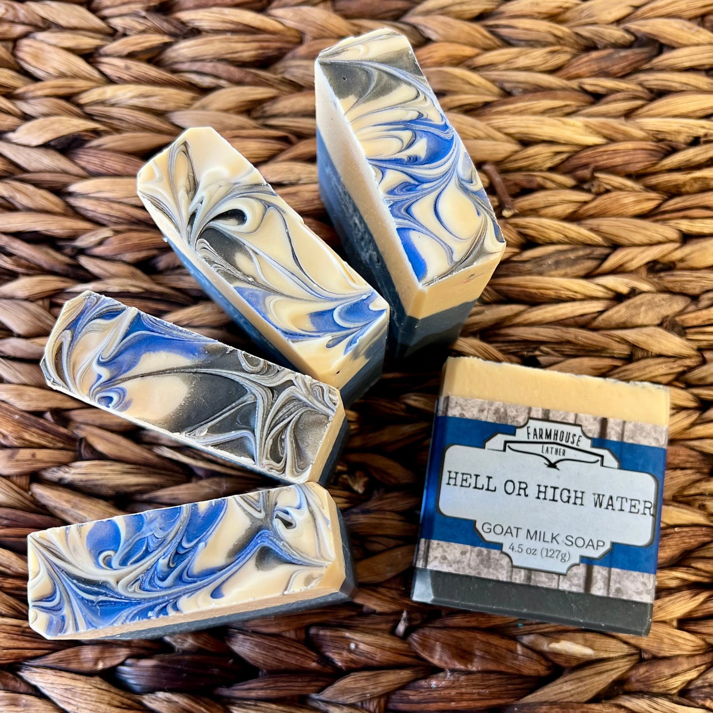 Set of blue-and-cream swirled soap bars with visible stamped edges
