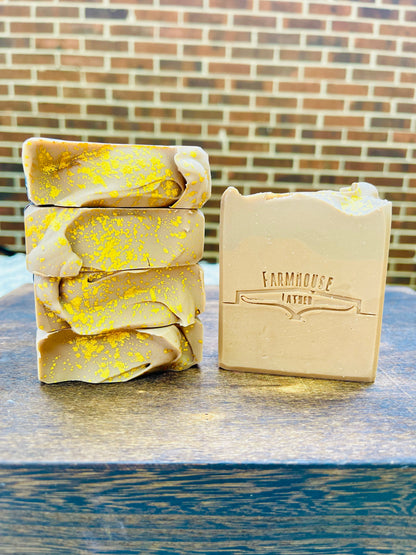 Pumpkin butter soap bars, yellow speckled wraps and a beige labeled bar