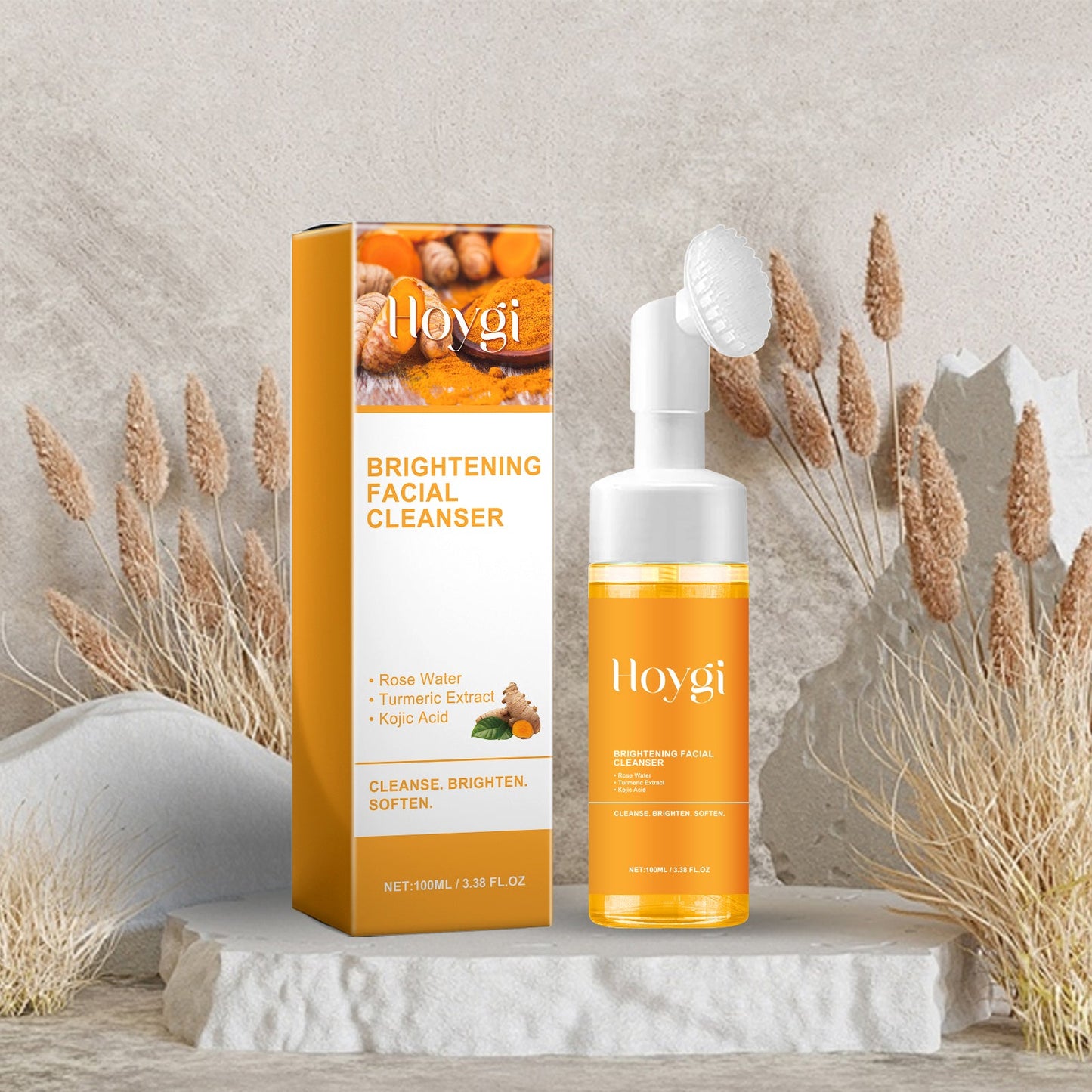 Orange facial cleanser bottle with white pump and upright brightening cleanser box