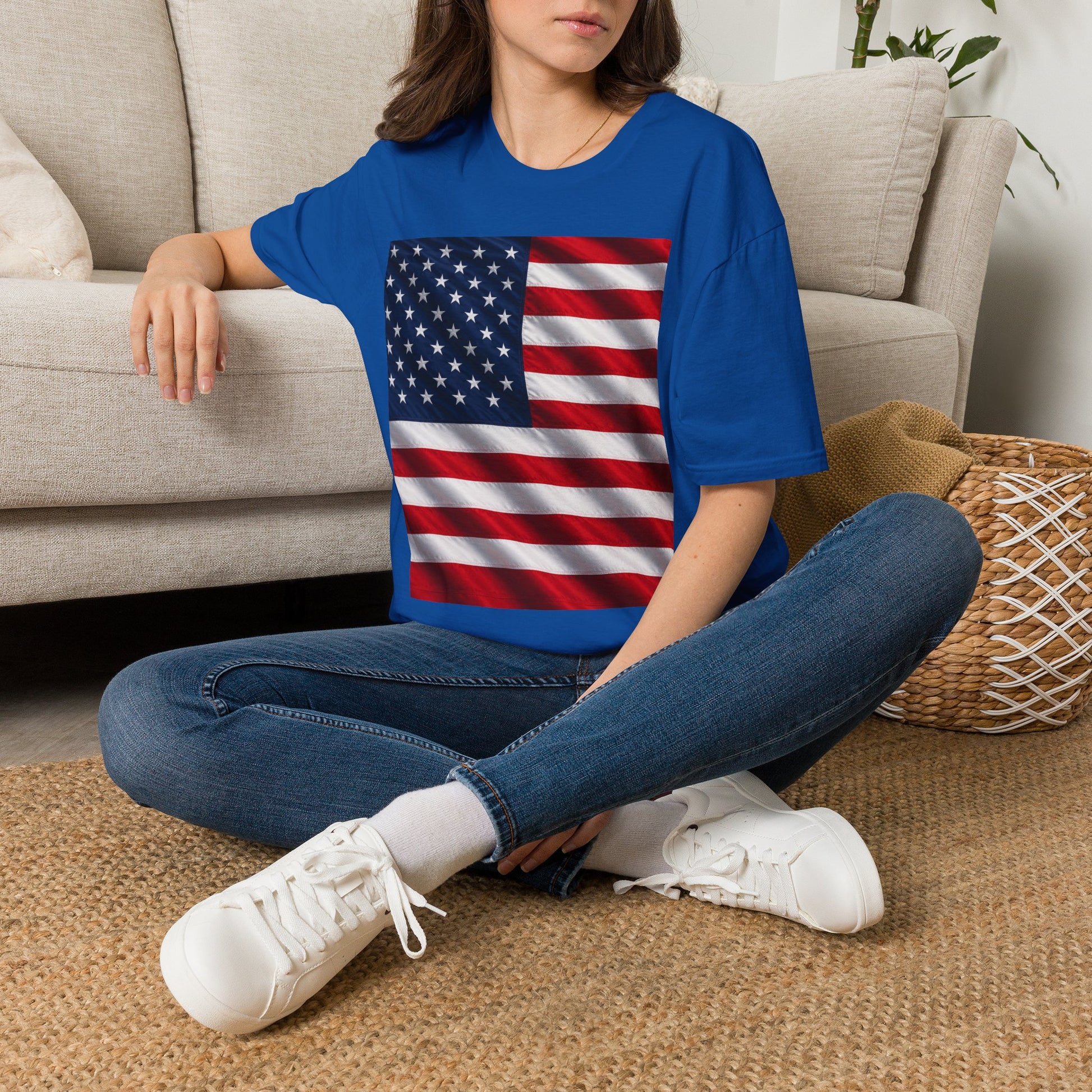 Graphic T-shirt, royal blue, square American flag print, worn by model sitting