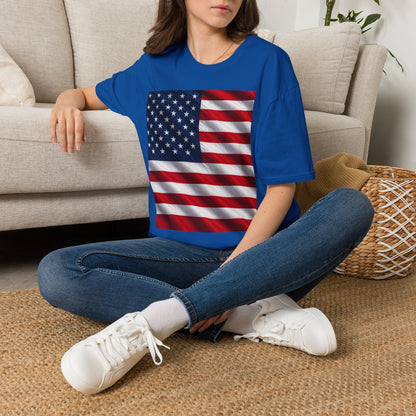 Graphic T-shirt, royal blue, square American flag print, worn by model sitting
