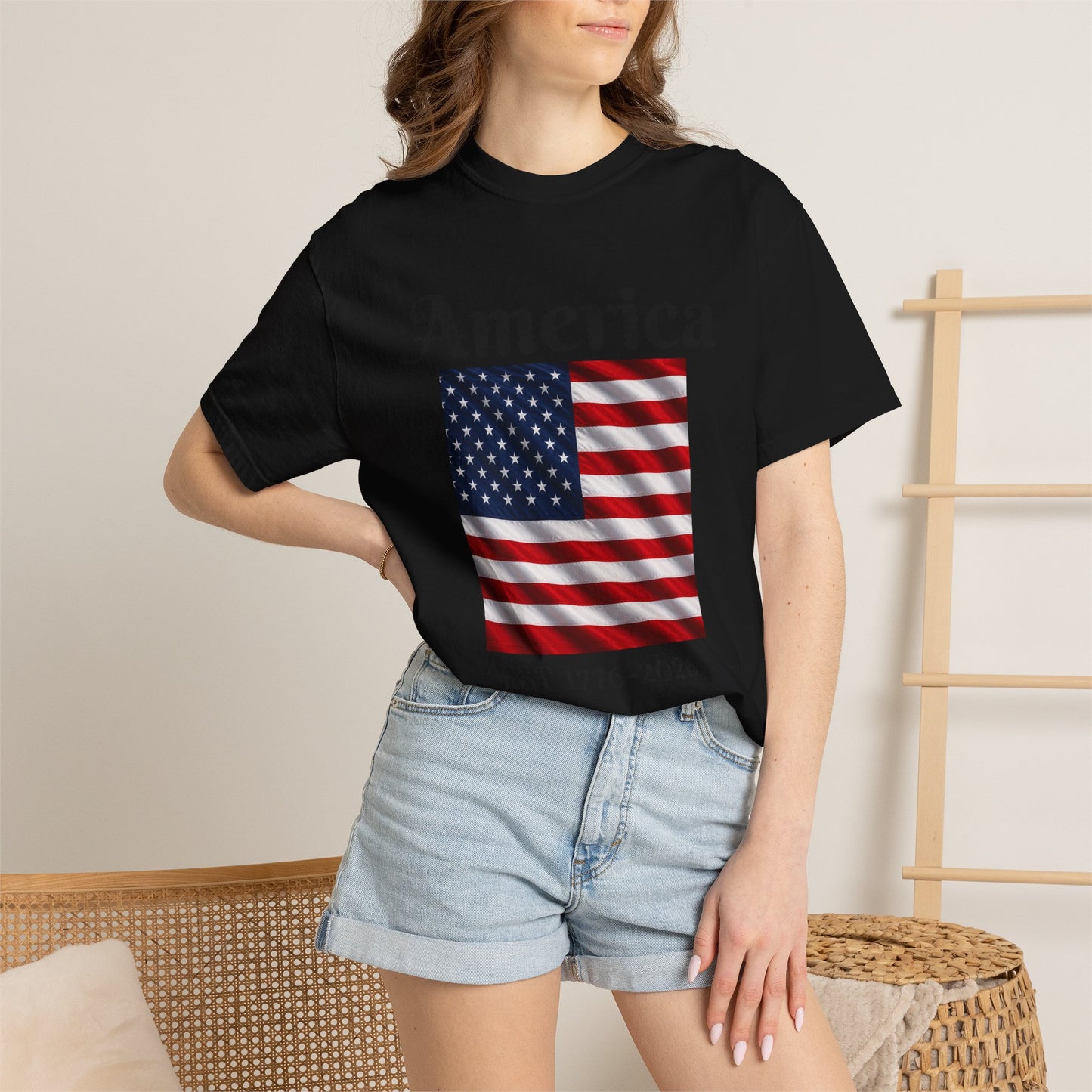 Black T-shirt on model with America flag square graphic centered at the chest