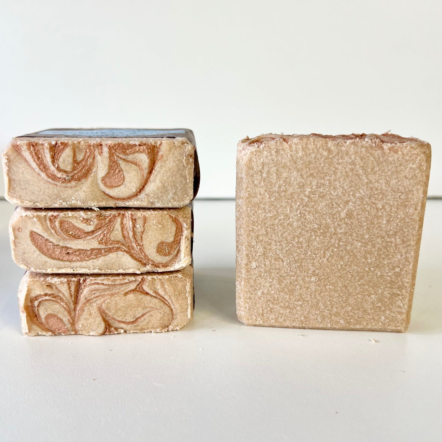 Maple flapjacks sea salt soap bars with marbled swirl pattern, plus one plain bar.