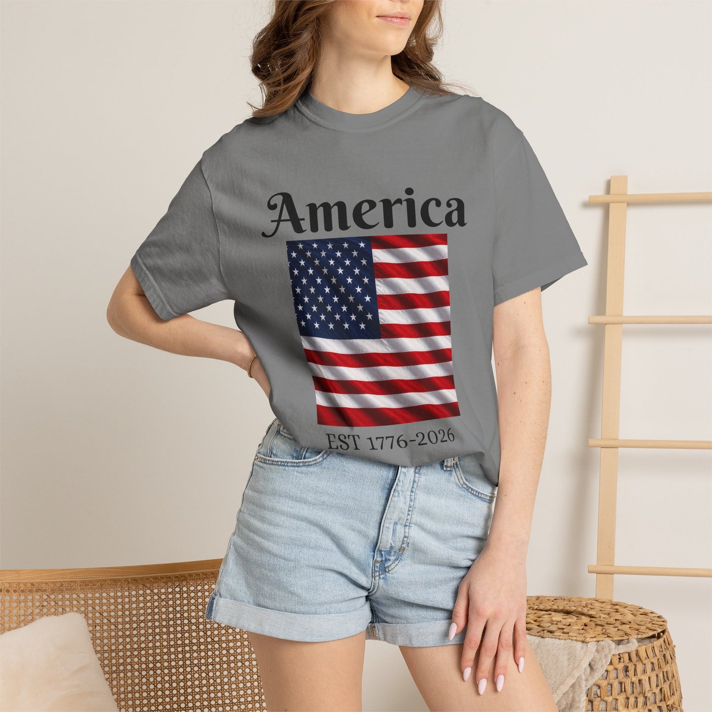 Dark gray T-shirt with America script over U.S. flag and EST 1776-2026 text